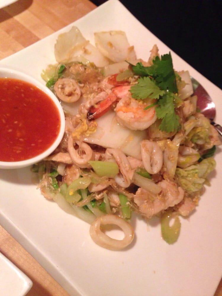 Sukiyaki · Wok-fried silver noodle, prawns, calamari and chicken, egg and Napa cabbage.