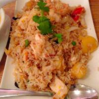 Pineapple Fried Rice · Fried rice with chicken and prawns, egg, tomato, onion, green onion, raisins and cashew nuts.