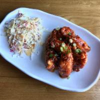 A5. Chicken Wings (5pcs) · Korean-style deep-fried chicken wings tossed in our signature sauces served with a side of p...