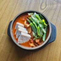 S5. Kimchi Jjigae Soup · Spicy kimchi and pork stew with scallions and tofu.