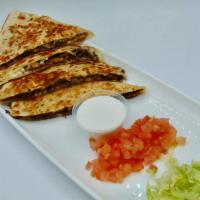 Quesadilla · Served with choice of meat and a Side of lettuce, tomato and sour cream.
