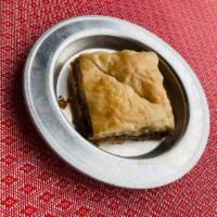 Traditional Middle East Baklava · Layers of filo dough stuffed with walnuts.