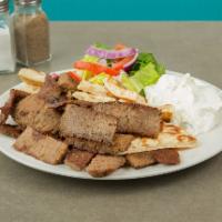 Gyro Platter · Greek salad, slices of gyro, lamb or chicken and hot pita on the side.