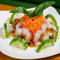 Y9. Raw Shrimp Salad · Topped with bitter melon, garlic, chili and spicy lime dressing. New York Timeout- The 100 T...