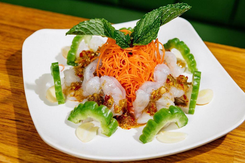 Y9. Raw Shrimp Salad · Topped with bitter melon, garlic, chili and spicy lime dressing. New York Timeout- The 100 Tastes You've to Try. Spicy.