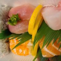 Deluxe Combo · 6 pieces sashimi, 4 pieces sushi, 8 pieces crab roll, 2 pieces shrimp, and 3 pieces vegetabl...