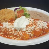 Breakfast Chilaquiles Rojos Plate · Served with 3 eggs, beans and potatoes.