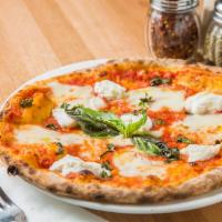 Ricotta Pizza · Tomatoes, mozzarella, basil and ricotta cheese.