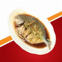 Uyghur Whole Fish · Pomfret fish with ginger, garlic and green onions seasoned with house spices and sauce.