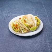 Chicken Tacos · Chicken, mild cilantro sauce, shredded lettuce, pico de gallo and avocado.