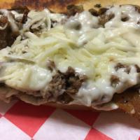 Philly Cheesesteak · Shaved ribeye, sauteed onions, mushrooms and cream cheese. Topped with our special blend of ...