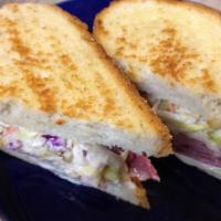 Corned Beef Special · Corned beef on grilled rye bread with coleslaw, Swiss cheese and Russian dressing.