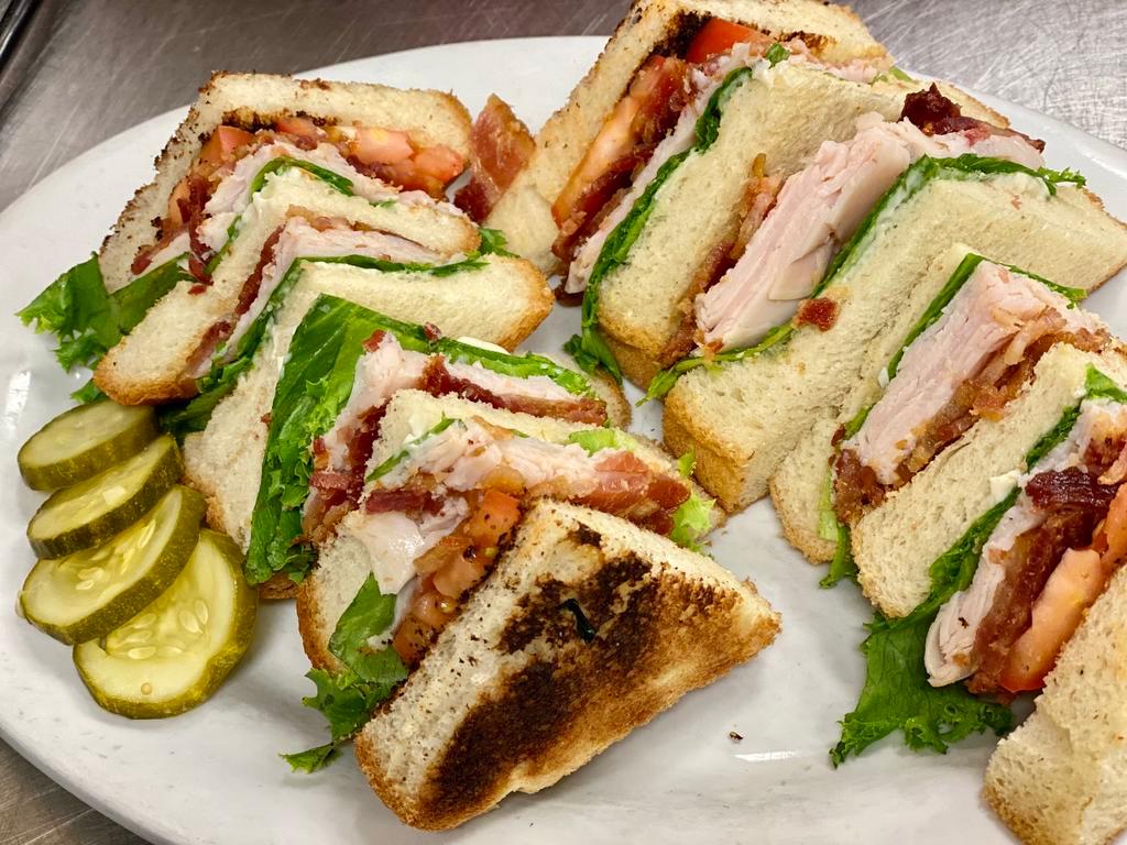 Club Sandwich · Smoked turkey, bacon, American cheese, lettuce, tomato and mayonnaise on triple white toast.