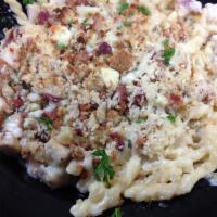 Chicken and Bacon Mac · Grilled chicken and crispy bacon tossed with penne noodles in a white cheese sauce, topped w...