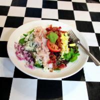 Cobb Salad · Assorted greens, bacon, turkey, bleu cheese, red onion, hard boiled eggs, guacamole and cape...
