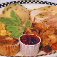 Roasted Turkey Dinner · Served with mashed potatoes, stuffing, turkey gravy, vegetables, cranberry orange relish and...