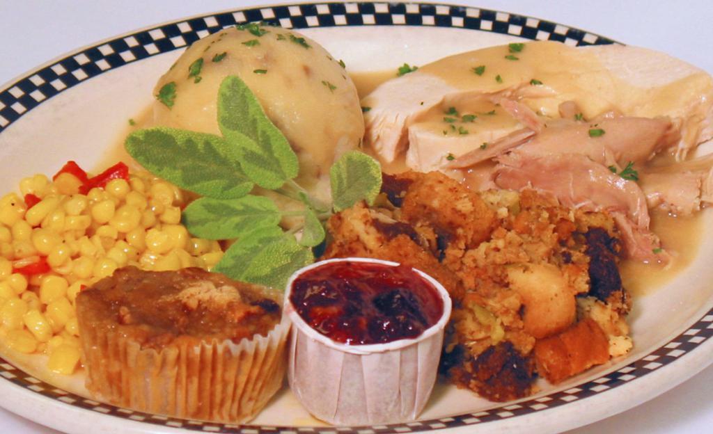 Roasted Turkey Dinner · Served with mashed potatoes, stuffing, turkey gravy, vegetables, cranberry orange relish and sweet potato pie.