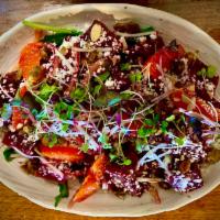Beet Salad · Orange supremes, requeson cheese, candied pepitas, aged sherry vinaigrette 