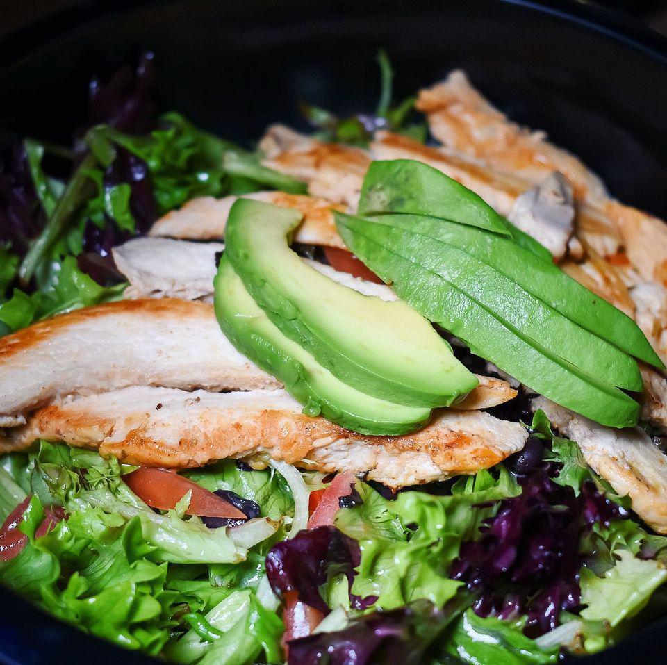 Ranchero Chicken Salad · Grilled chicken, organic greens, roasted peppers, avocado, black beans, and tomato lemongrass vinaigrette.