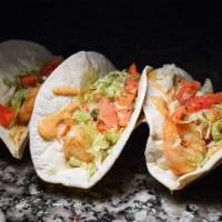 Shrimp Tacos · 2 pieces. Flour tortilla, grilled shrimp, chipotle mayo, lettuce, and pico de gallo.