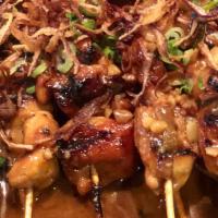 Satay Chicken Appetizer · Skewered chicken with peanut sauce. Tapes style serving.