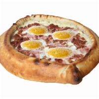 Canadian Bacon(Ham) and Bacon Egg Gondola Pizza · Mozzarella cheese, feta cheese, 1 - 2 eggs, ham, bacon, slice of butter and a sprinkle of bl...