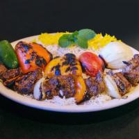 7. Shish Kabob · Chunks of marinated beef tenderloin cooked over open fire. Served with basmati rice, Salad, ...