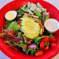 Cobb Salad · Crisp mixed greens topped with a chilled breast of chicken, bacon, egg, avocado, bleu cheese...