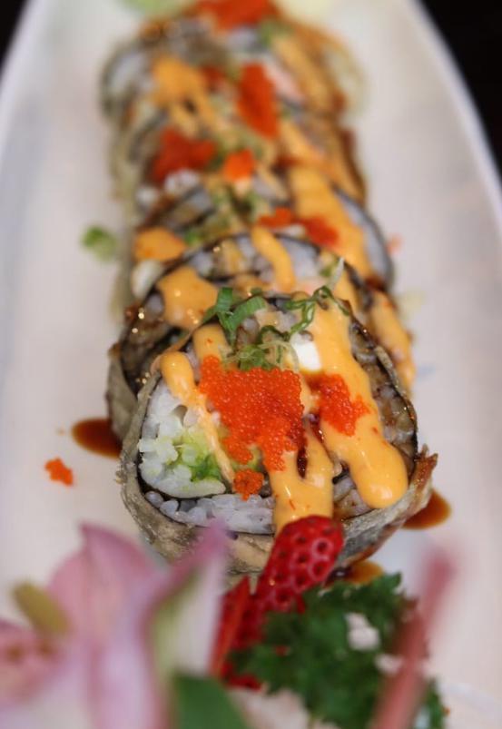 Crazy Roll · In salmon, white tuna, avocado, and cream cheese dipped in tempura batter then flash fried. Out masago, scallion, with spicy mayo, and eel sauce.