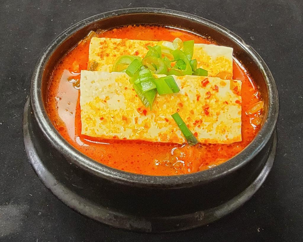 Kimchi Jjigae · Kimchi stew with pork and tofu.