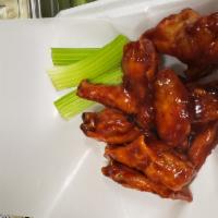 10 Buffalo Wings · 10 Chicken Wings, fried with choice of 7 sauces and choice of Blue Cheese or Ranch Dressing