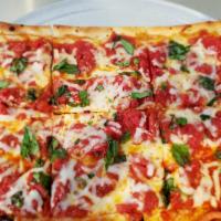 Grandma Pizza by the Slice · Square, thin crust with plum tomatoes, garlic, oil, Romano and fresh basil.