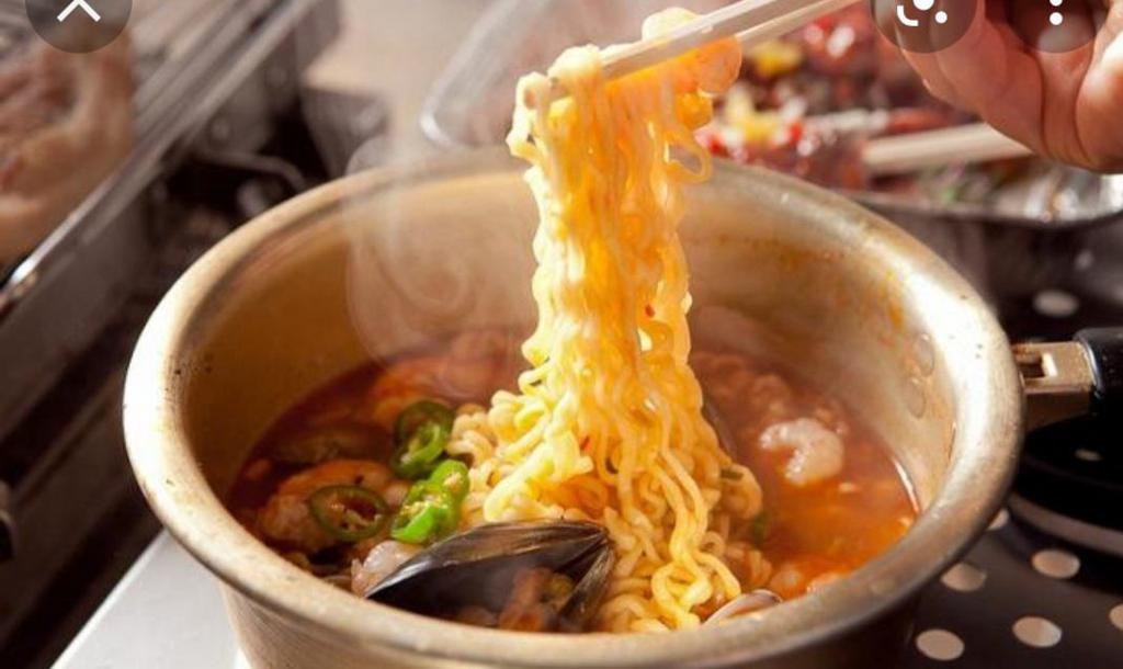 Spicy Korean Ramen · Korean-style spicy ramen noodle with assorted vegetables, mushroom, egg, corn.