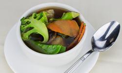 Hong Kong Style Won Ton Soup · Clear chicken broth with carrots, mushrooms, snow peas, and broccoli, and a few pieces of Ho...