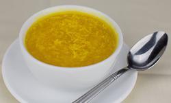 Chicken Corn Soup · Clear chicken broth with creamy corn and egg drop with white meat chicken pieces.