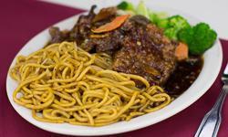 Orange Beef · A few cuts of beef, breaded, deep fried with a sauce containing orange peels. Served with lo mein on the side.