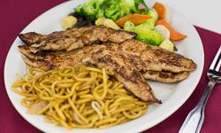 Teriyaki Chicken · Marinated grilled chicken breast with vegetables and lo mein on the side.
