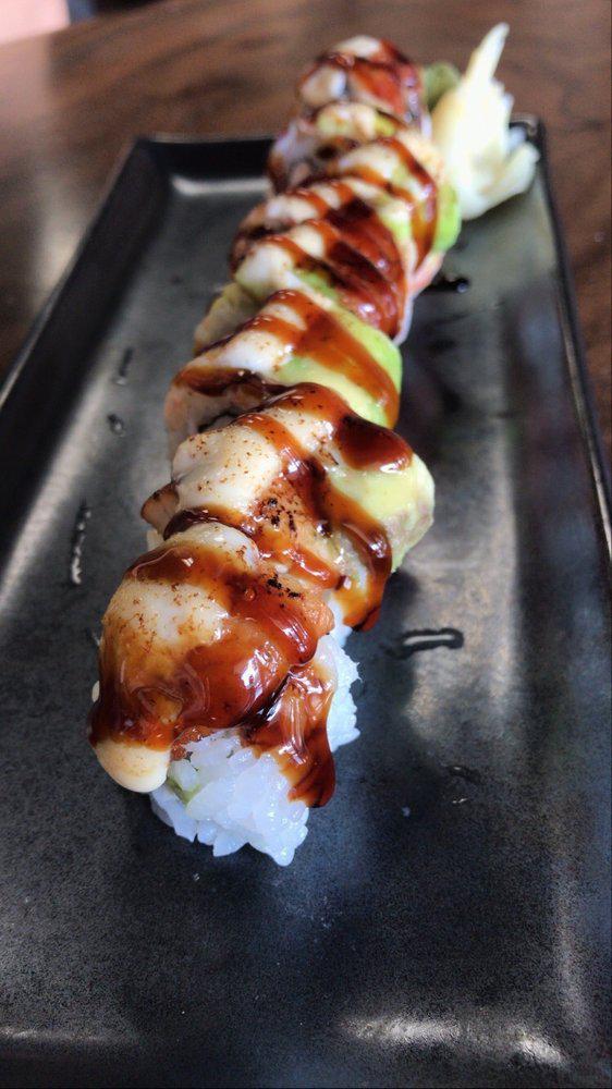 Heart Attack · Carlifornia roll topped with cook shrimp, BBQ eel, avocado, seared with garlic cream sauce, unagi sauce on top.