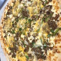 Cheesesteak Pizza · Stuffed with peppers, onions, steak, American and mozzarella cheeses.