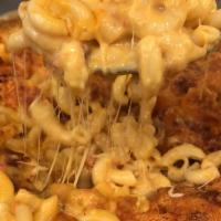 Macaroni and Cheese · FROM SCRATCH. Our mac and cheese has a touch of stewed tomatoes to balance all the cheese. T...