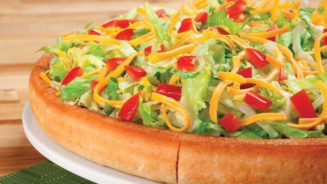 Taco Pie · Beef, onions, lettuce, tomatoes, taco sauce, cheddar cheese, and mozzarella cheese.