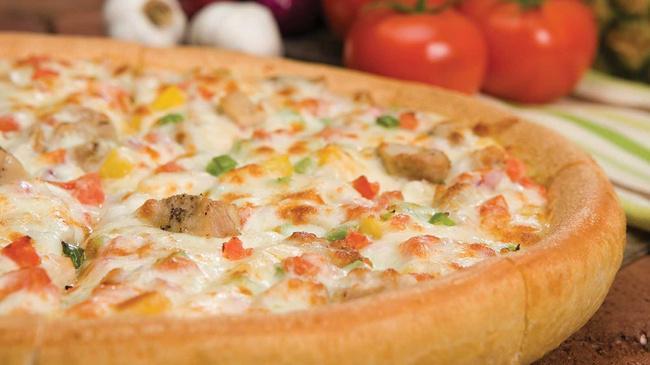 Chicken Royale · A tasty blend of garlic white sauce, grilled chicken, red onions, green peppers, pineapple, and fresh tomatoes.