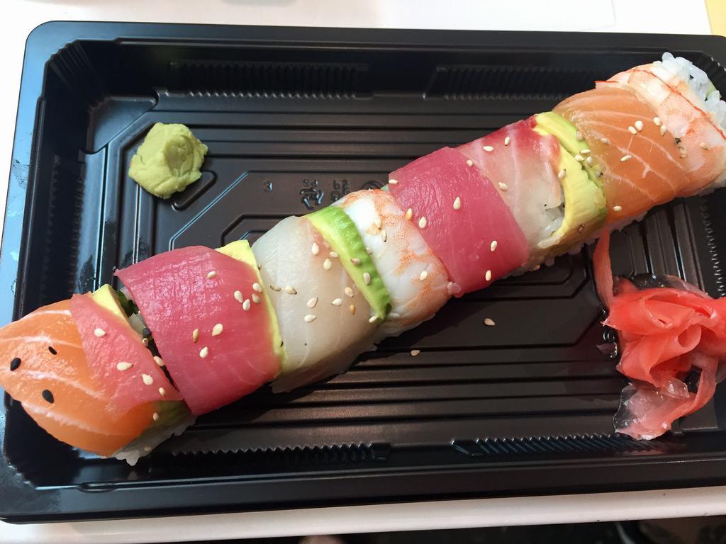 M6. Rainbow Roll · California roll topped with salmon, shrimp, tuna, white fish and avocado. 8 pieces.