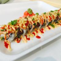 M16. Deluxe Spicy Salmon Roll · Spicy crunchy salmon topped with salmon, spicy mayo, crunch, green onion and hot chili sauce...