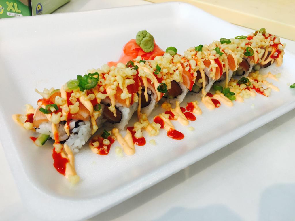 M16. Deluxe Spicy Salmon Roll · Spicy crunchy salmon topped with salmon, spicy mayo, crunch, green onion and hot chili sauce. 8 pieces.