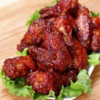 9A. BBQ Fried Chicken Wings · 10 pieces. Served with fries. Cooked wing of a chicken coated in BBQ sauce.