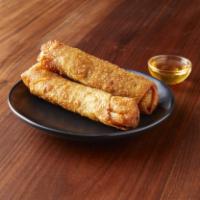01. Egg Rolls · Crispy homemade egg rolls stuffed with cabbage and carrot served with sweet and sour sauce.