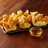 06. Crab Rangoon · Fried wonton filled with cream cheese, crab meat and celery, served with special house sauce.