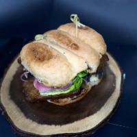 La Chilanga Torta · hicken breast milanesa, black bean puree, tomato, lettuce, red onion, avocado, chipotle aiol...