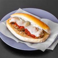 Meatball Parmigiana Sub · Sandwich with seasoned meat that has been rolled into a ball topped with tomato sauce and ch...